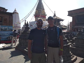 Kathmandu Nepal Father son family travel old soled turtle and bear Swambanath Stupa Temple