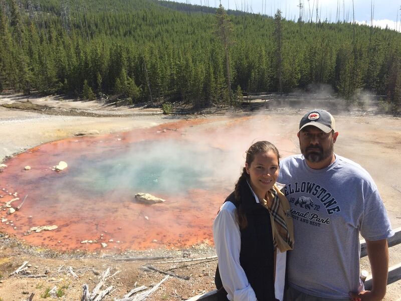 Happy couple beautiful colorful hot springs yellowstone national park