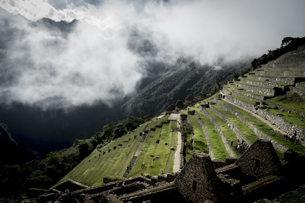 Mist blowing into terraces at Machu Picchu
